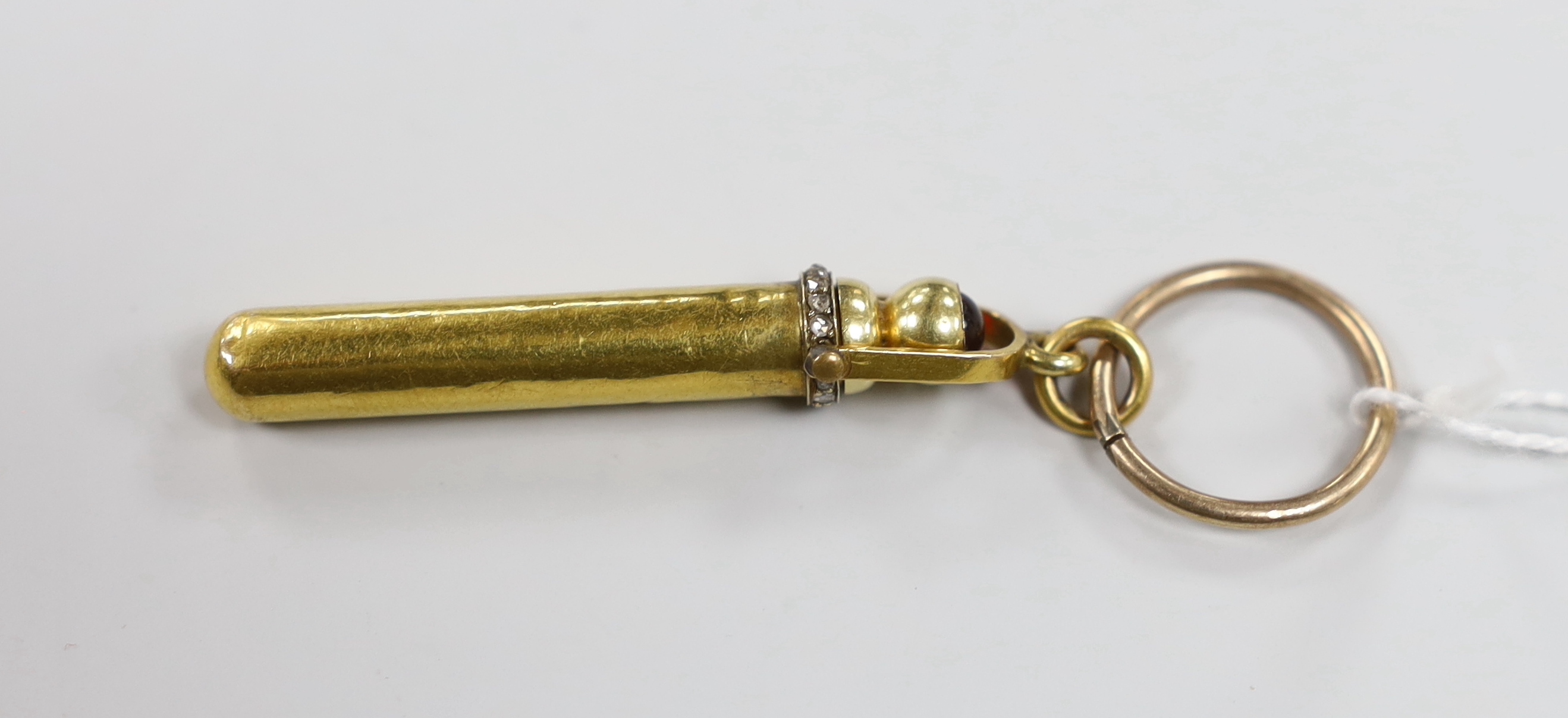 A late Victorian yellow metal, rose cut diamond and red cabochon set propelling pencil and case, 46mm.